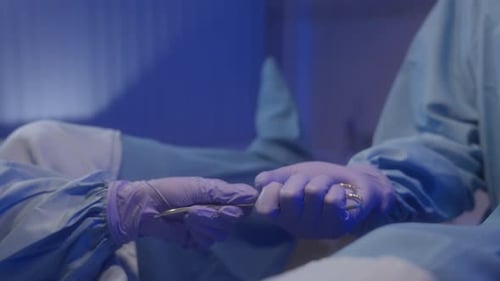 Medical Professional Holding a Surgical Instrument