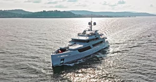 Aerial View Tracking of Beautiful Modern White Super Yacht Lifestyle Luxury Boat Sailboat