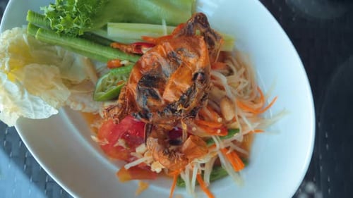Thai Food Concept with Spicy Green Papaya Salad Fried Crab