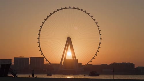 Sun shining behind the Ain Dubai Ferris wheel, Dubai