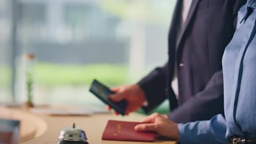 Hotel Guests Arriving Reception Closeup Man Hand Ringing Bell in Lobby Counter