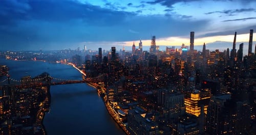 Rising over the night panorama of New York, USA. Twilight scenery of the city at storm.