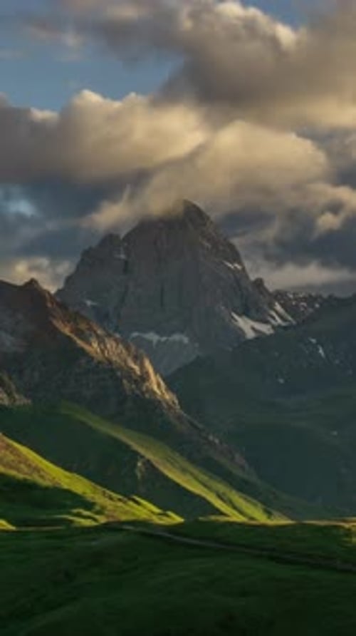Scenic Mountain Peak Landscape with Rolling Clouds