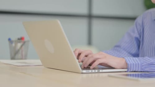 Close Up of Businesswoman Working on Laptop