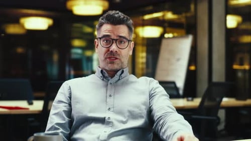 Male Office Worker During Online Meeting