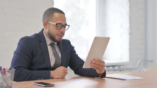 Man in Suit Having Tablet Computer Video Call