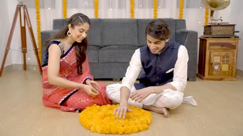 Young Couple Arranges Flowers for Diwali Celebration