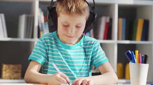 Boy Learning at Home With Headphones On
