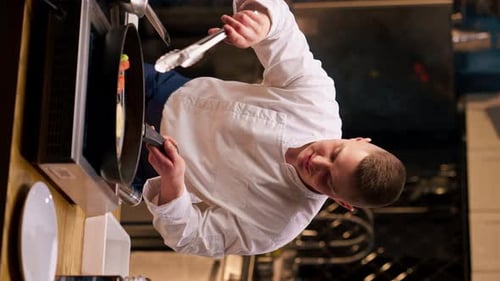 Young Adult Chef Cooking Food in Pan