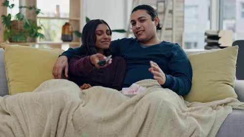 Loving Couple Relaxing at Home on Couch