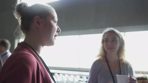 Colleagues Chatting During Office Coffee Break Indoors