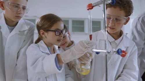 Children Conduct Science Experiment in School Lab