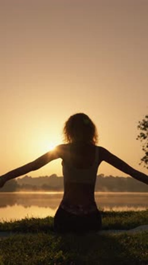 Woman Doing Yoga at Sunrise on Lake