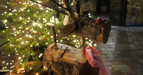 Rustic Wooden Deer Decoration Near Christmas Tree