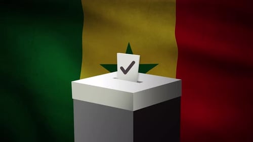 Casting Vote Into The Ballot Box During Senegal Election