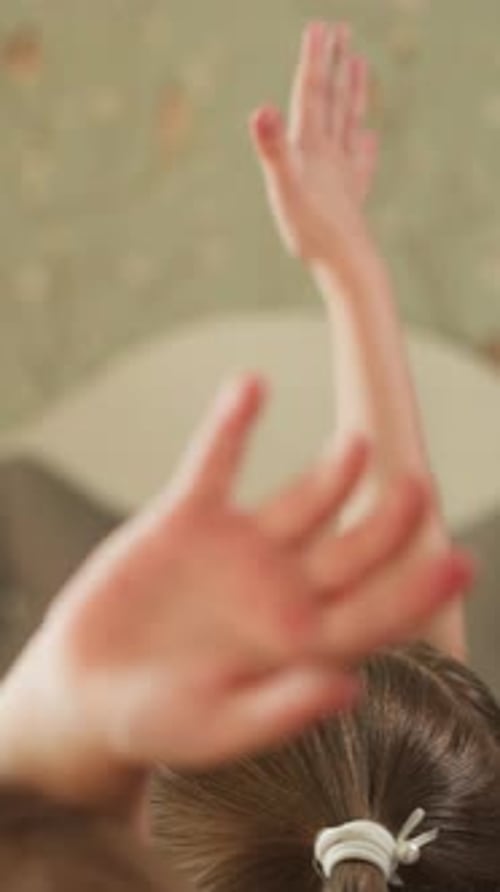 Child Getting Hands Raised Playing