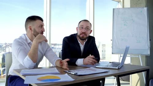 Business Meeting Presentation in Modern Office