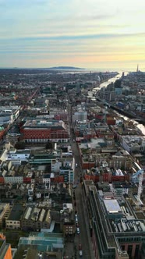 Aerial drone view of bridges over the River Liffey in Dublin, Ireland in daylight. Vertical