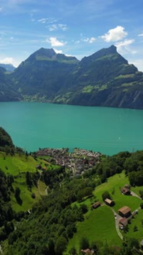 Aerial view of picturesque village Bauen situated on the shores of Lake Lucerne in the Swiss Alps