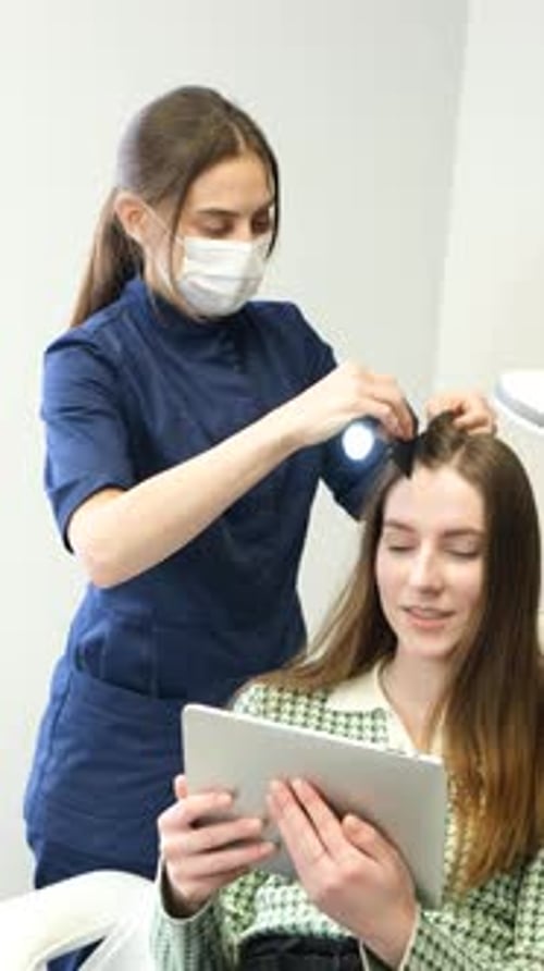 Computer Trichoscopy A Trichologist Examines a Patient's Hair with a Trichoscope in a Clinic