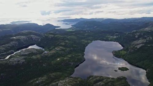 Serene lakes and winding rivers in Norway's aerial perspective.