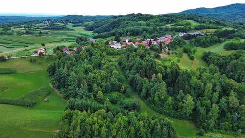 Valley with Fields Meadows Agricultural Farms Forests and Houses