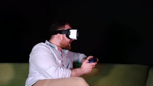 Man Wearing VR Headset Playing Video Games