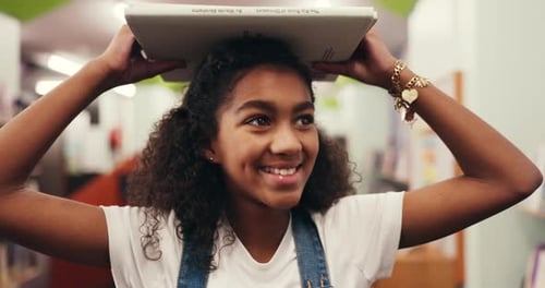 Child, student and book on head in library for learning, story time and literature education