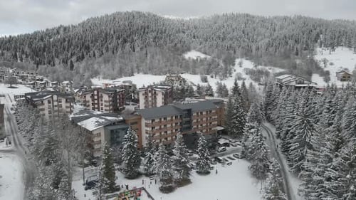 Aerial shot of Mountain Village in Winter with snow