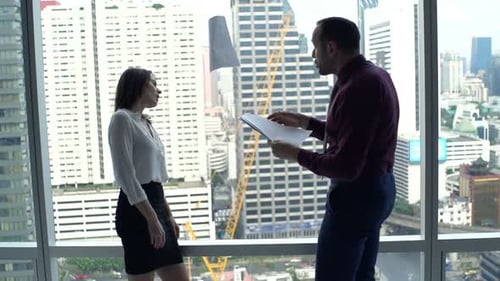 Young Businesspeople with Documents Fighting in Office, Super 120