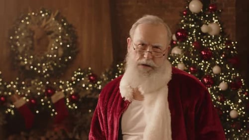 Senior Man in Santa Claus Outfit Confidently Posing for Camera