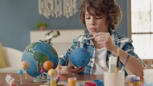 Painting Of Blue Ball By Small Man. Paintbrush In Hand Of Sitting School Pupil. Educational Draw ...