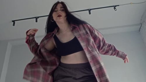 Female Dancer Showing Contemporary Moves on Camera in Minimalist Studio