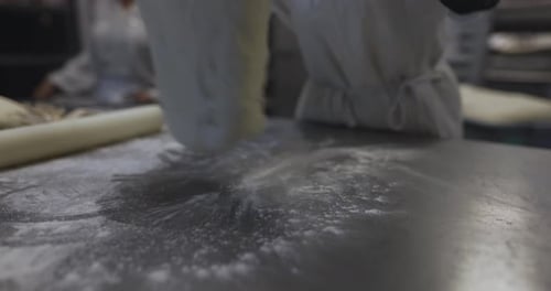 Baker Kneading Preparing Bread Dough in Bakery Kitchen 10 Seconds or Greater