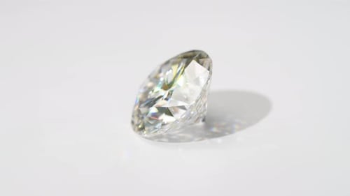 Rotating Faceted Diamond on White Background