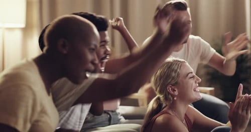 Friends Watching and Cheering Indoors