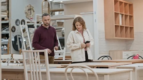 Couple Looking at Kitchen Furniture while Shopping