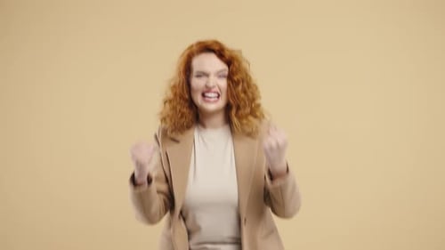 GingerHaired Businesswoman With Triumph Yes Victory Gesture Jackpot Success