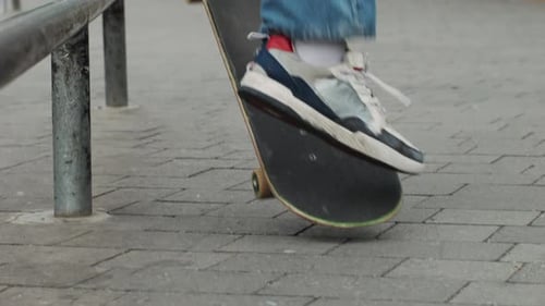 Young Skater Making 360 Flip Jump Performing Kickflip Trick Skateboarder Training in Skatepark