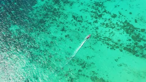 Aerial view of iconic tropical turquoise water Pileh Lagoon surrounded by limestone cliffs, Phi Phi