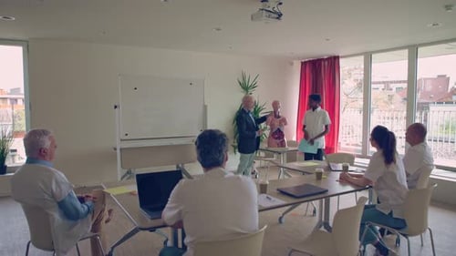 Medical Professionals Collaborate in Conference Room
