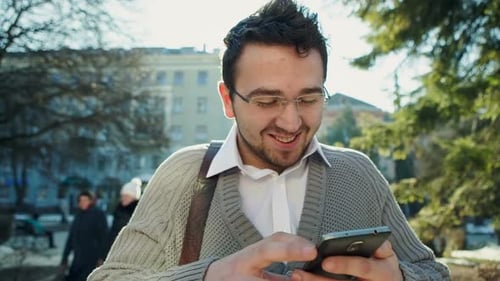 Young Urban Professional Man Using Smart Phone