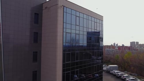 Panoramic View of Glass Facade of Office Skyscraper at Twilight