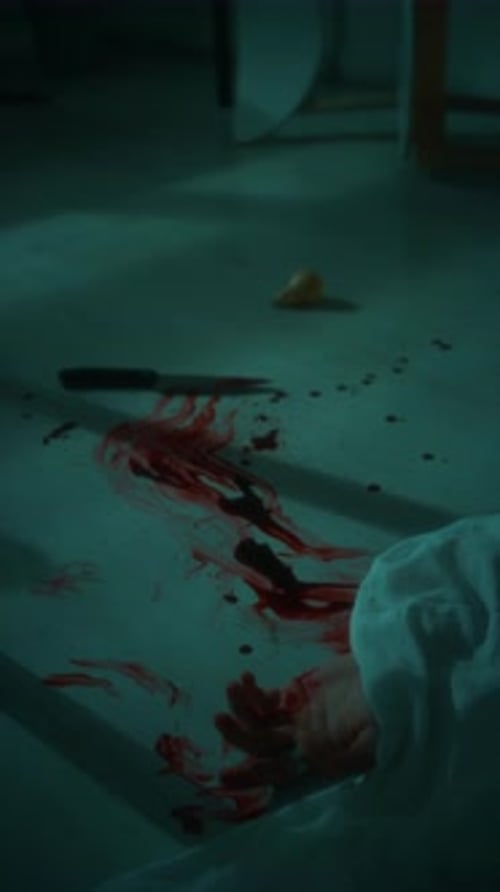 Hand of Murdered Victim near Blood Pool and Knife