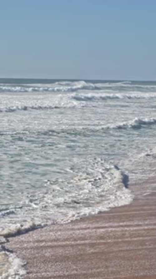 Sea Waves Cover the Shore