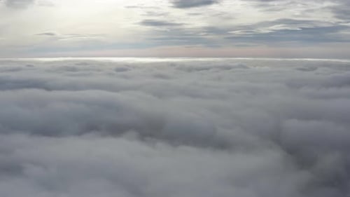 Aerial View Above Thick Layer of Fluffy Clouds
