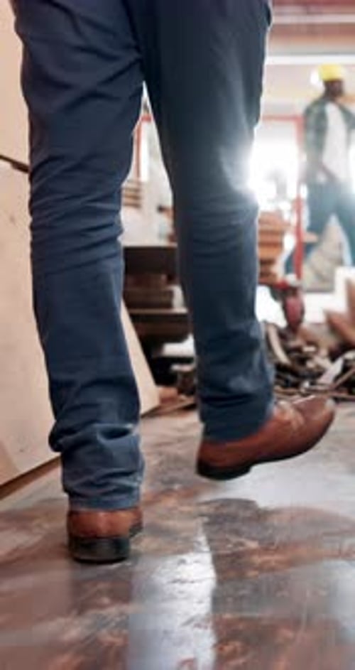 Carpentry, walking and legs of man in workshop, renovation project and production development