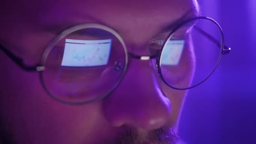 Close up of Data Screen Reflected in Glasses