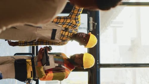 Vertical Video Team of Men Working on Stock Inventory in Warehouse