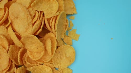 Crispy Corn Flakes on a Light Blue Surface